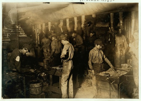 Boys working in a foundry.